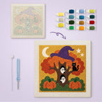 Witch Hat Autumn Tree canvas before and after punching, with the threads and tools