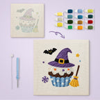 Witch Hat Cupcake canvas before and after punching, with the threads and tools