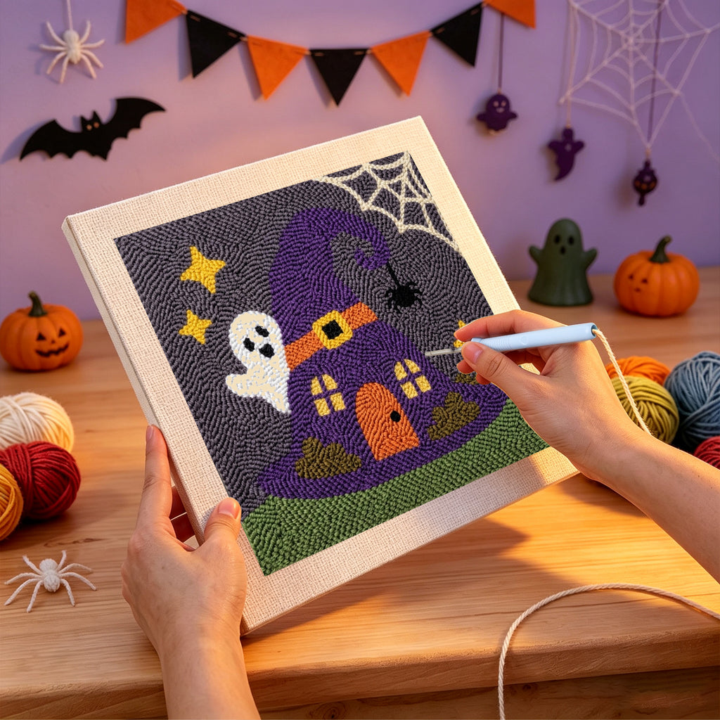 Punching the Witch Hat House design with the punch needle