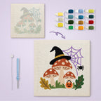Witch Hat Toadstools canvas before and after punching, with the threads and tools