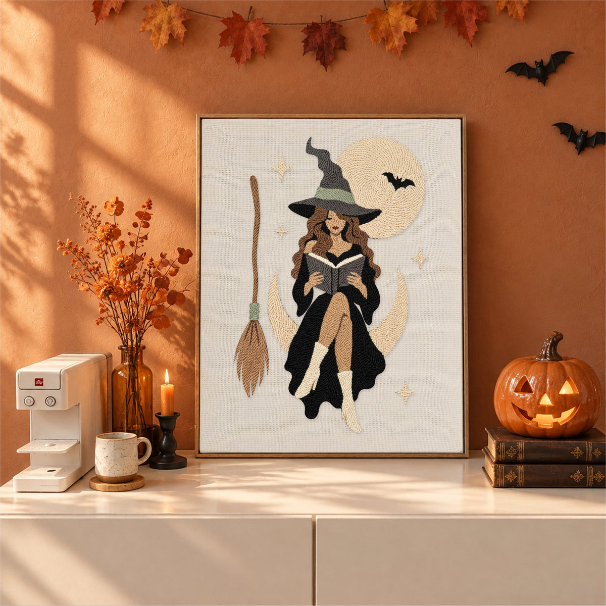 Finished Witch on a Crescent Moon punch needle canvas on a wall