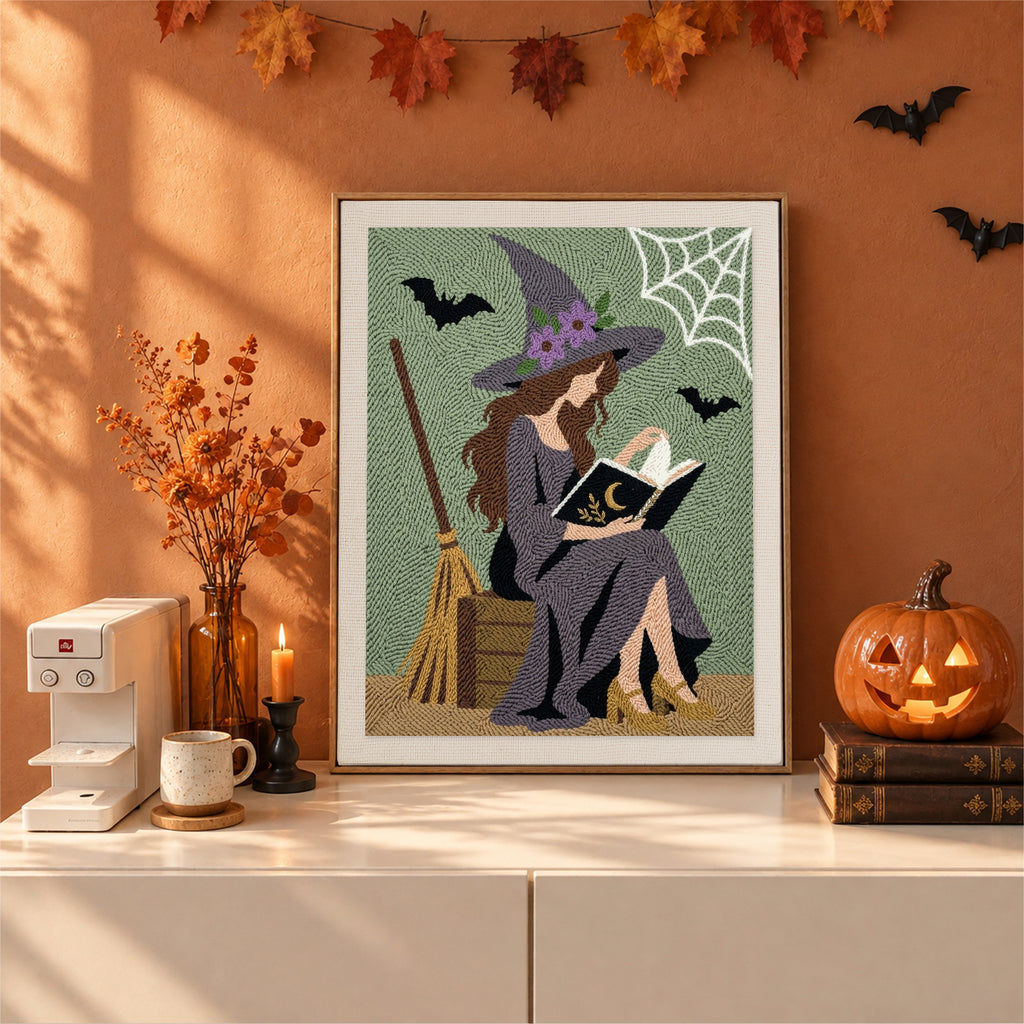 Finished Witch Reading Outdoors punch needle canvas on a wall