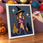 Punching the Witch with a Spell Book design with the punch needle