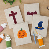 The four finished Wizard Hat Pumpkin mini canvases laid out on a table