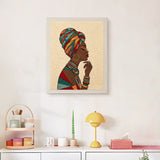 Finished Woman in Headwrap punch needle canvas on a wall