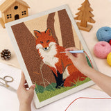 Punching the Woodland Fox design with the punch needle