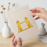 Hand holding a finished World Landmarks mini canvas