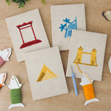 The four finished World Landmarks mini canvases laid out on a table