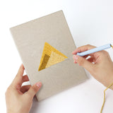Punching a World Landmarks mini canvas with the punch needle