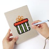 Punching a Wreath and Bell mini canvas with the punch needle