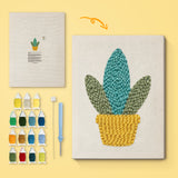Yellow Basket Plant canvas before and after punching, with the threads and tools