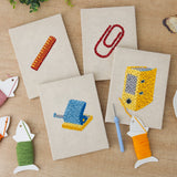 The four finished Yellow Binder Office mini canvases laid out on a table