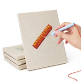 Hand punching one of the Yellow Binder Office mini canvases