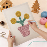 Punching the Yellow Pom Flowers design with the punch needle