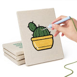 Hand punching one of the Yellow Pot Cacti mini canvases