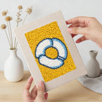 Hand holding a finished Yellow Sundae Glass mini canvas