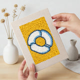 Hand holding a finished Yellow Sundae Glass mini canvas