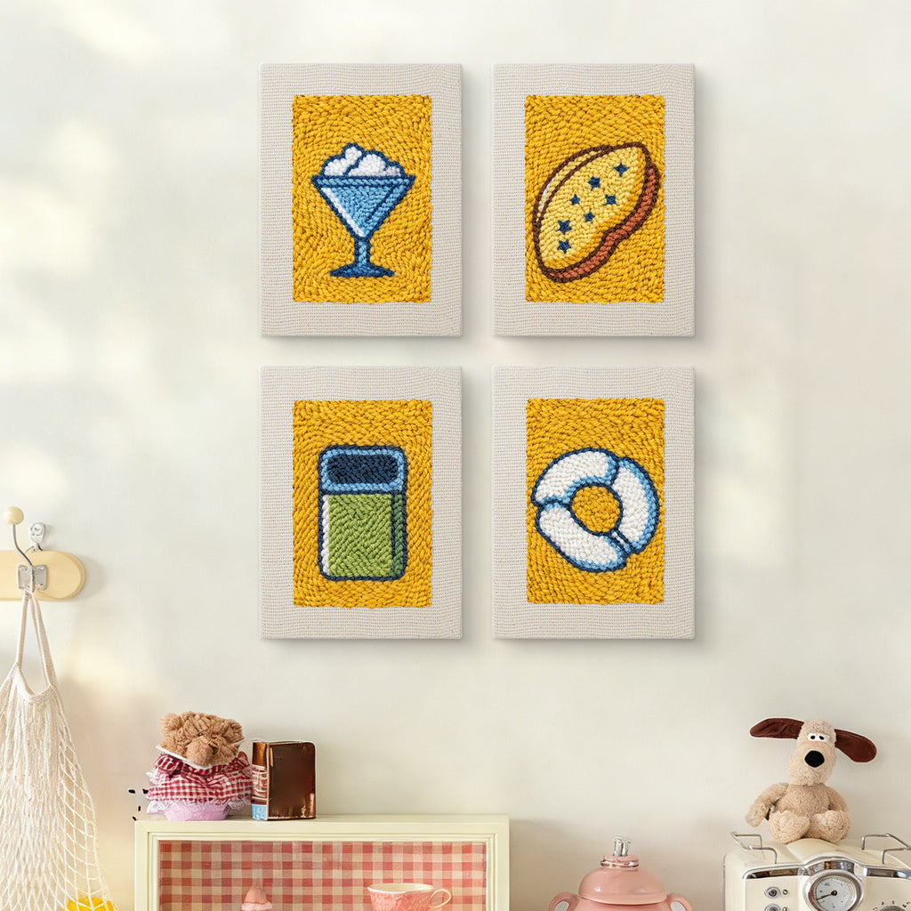 The four Yellow Sundae Glass mini canvases on a wall above a shelf