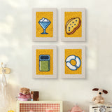 The four Yellow Sundae Glass mini canvases on a wall above a shelf