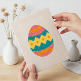 Hand holding a finished Zigzag Easter Eggs mini canvas