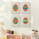 The four Zigzag Easter Eggs mini canvases on a wall above a shelf