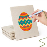 Hand punching one of the Zigzag Easter Eggs mini canvases