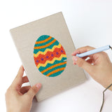 Punching a Zigzag Easter Eggs mini canvas with the punch needle