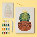Zigzag Pot Cactus canvas before and after punching, with the threads and tools