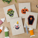 The four finished Zombie and Clown mini canvases laid out on a table