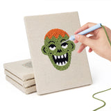 Hand punching one of the Zombie and Clown mini canvases