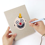Punching a Zombie and Clown mini canvas with the punch needle